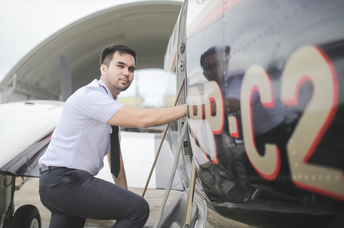 Capt. Wollen E. Ugat, Chief Ground Instructor, performing pre-flight walk-around on a CAFS aircraft